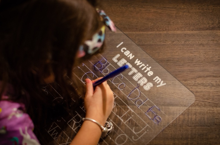 Reusable acrylic letter tracing board in use